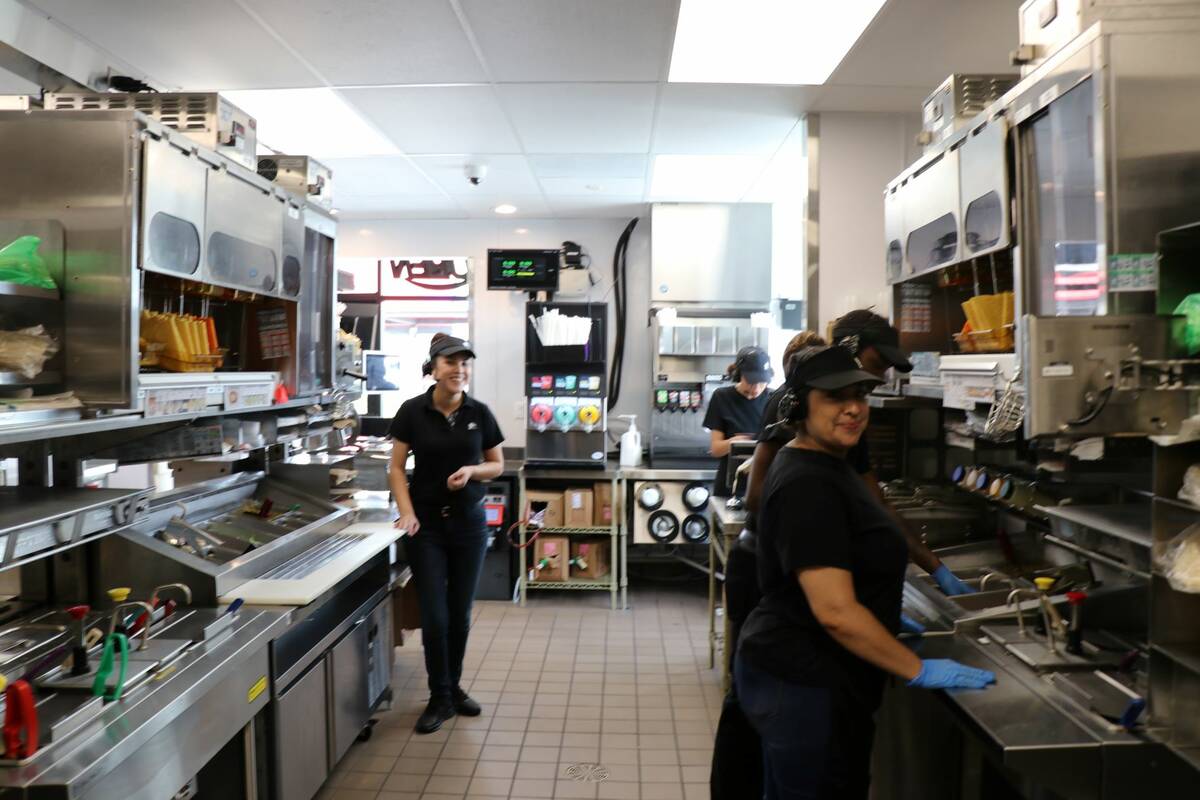 Taco Bell employees working inside the new Go Mobile location in North Las Vegas on Monday, Jul ...