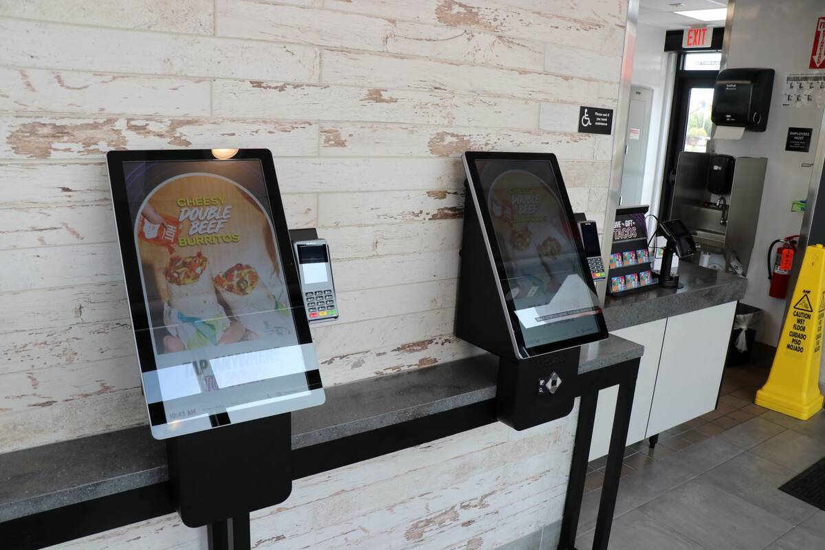 Customers at the new Taco Bell Go Mobile location can place their order at kiosks in front of t ...