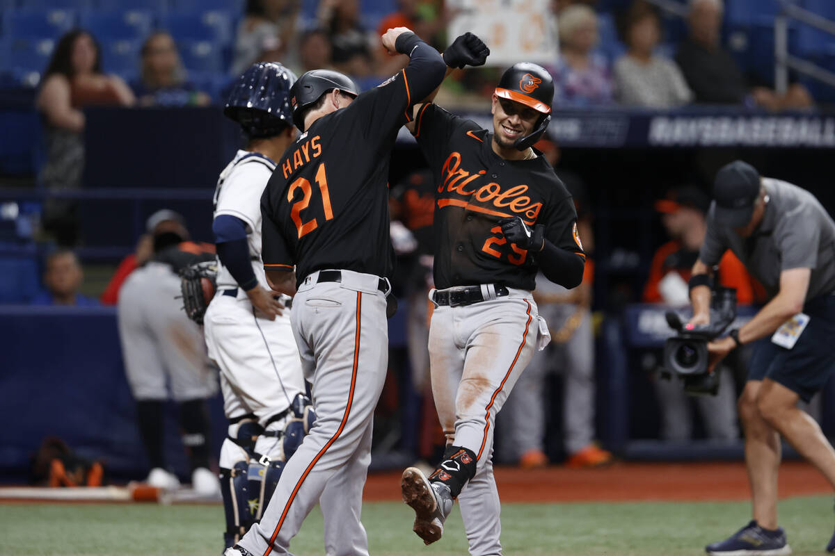 Baltimore Orioles third baseman Ramon Urias, right, celebrates with Austin Hays after hitting a ...