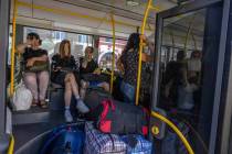 People wait on an evacuation bus, in Kramatorsk, eastern Ukraine, Tuesday, July 19, 2022. Donet ...