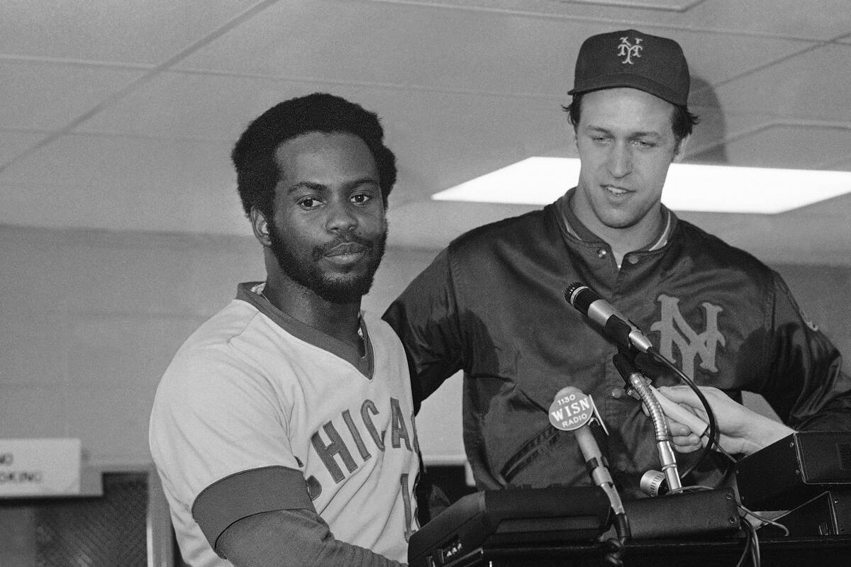 Bill Madlock, left, of Chicago Cubs and Jon Matlack, right, of New York Mets share their happin ...