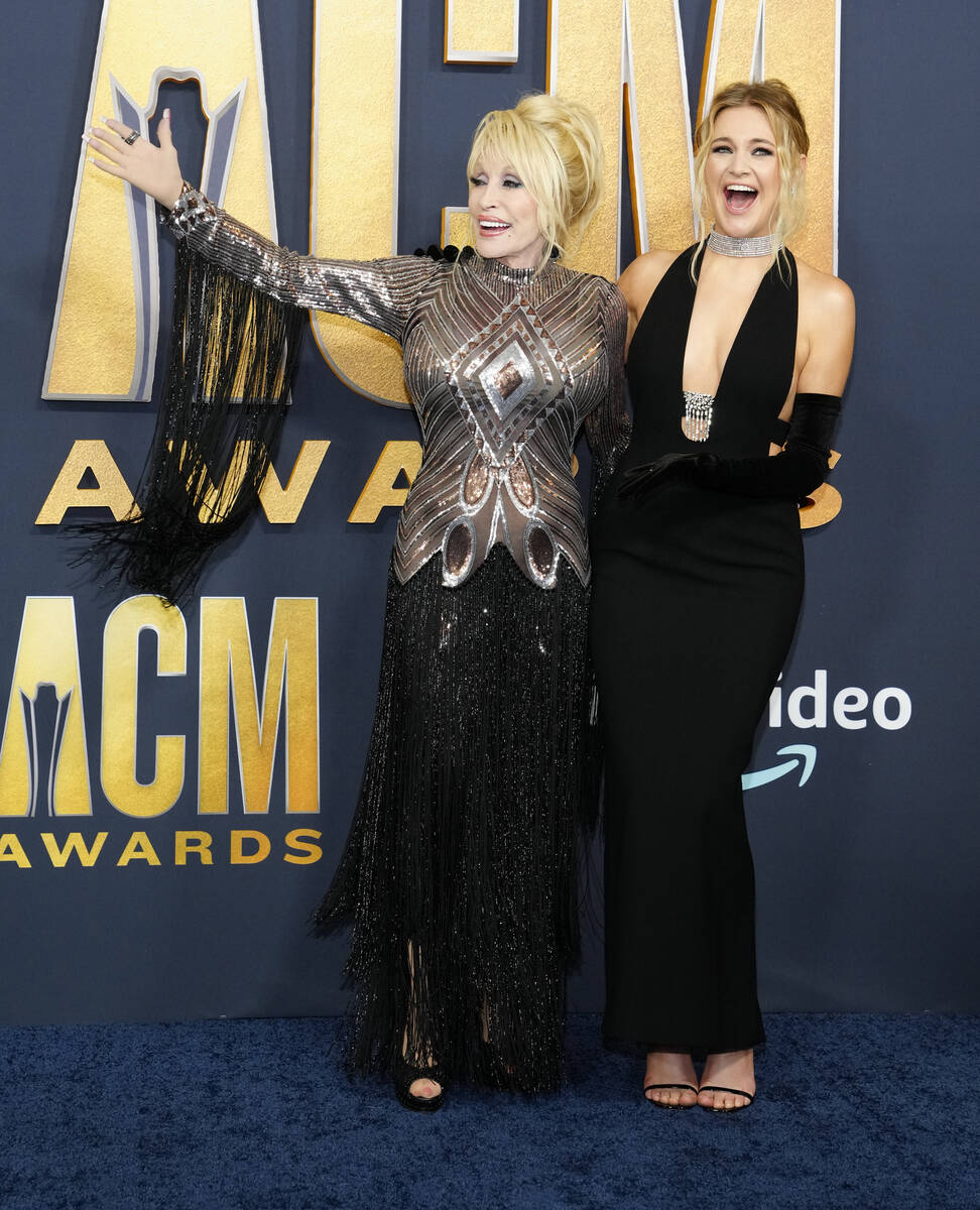 Dolly Parton, left, and Kelsea Ballerini arrive at the 57th Academy of Country Music Awards on ...