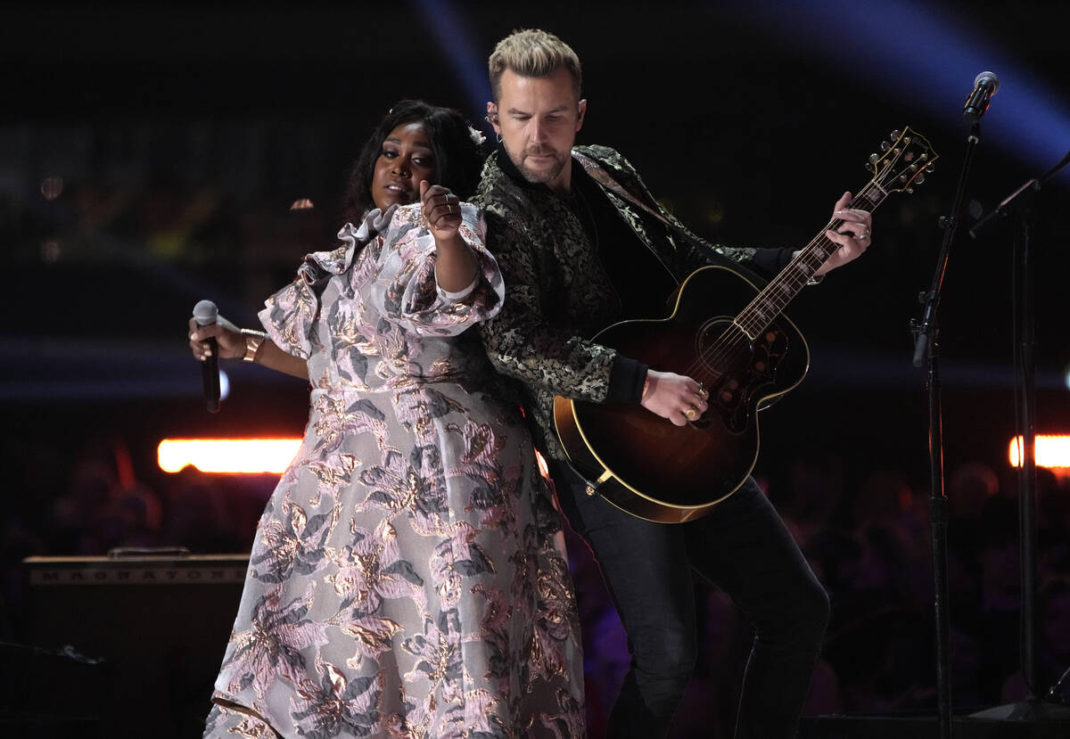 Brittney Spencer, left, and TJ Osborne perform "These Boots are Made for Walking" at ...