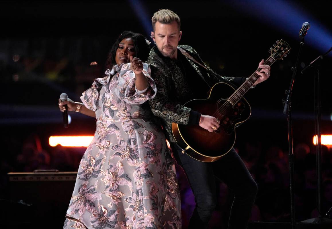 Brittney Spencer, left, and TJ Osborne perform "These Boots are Made for Walking" at ...