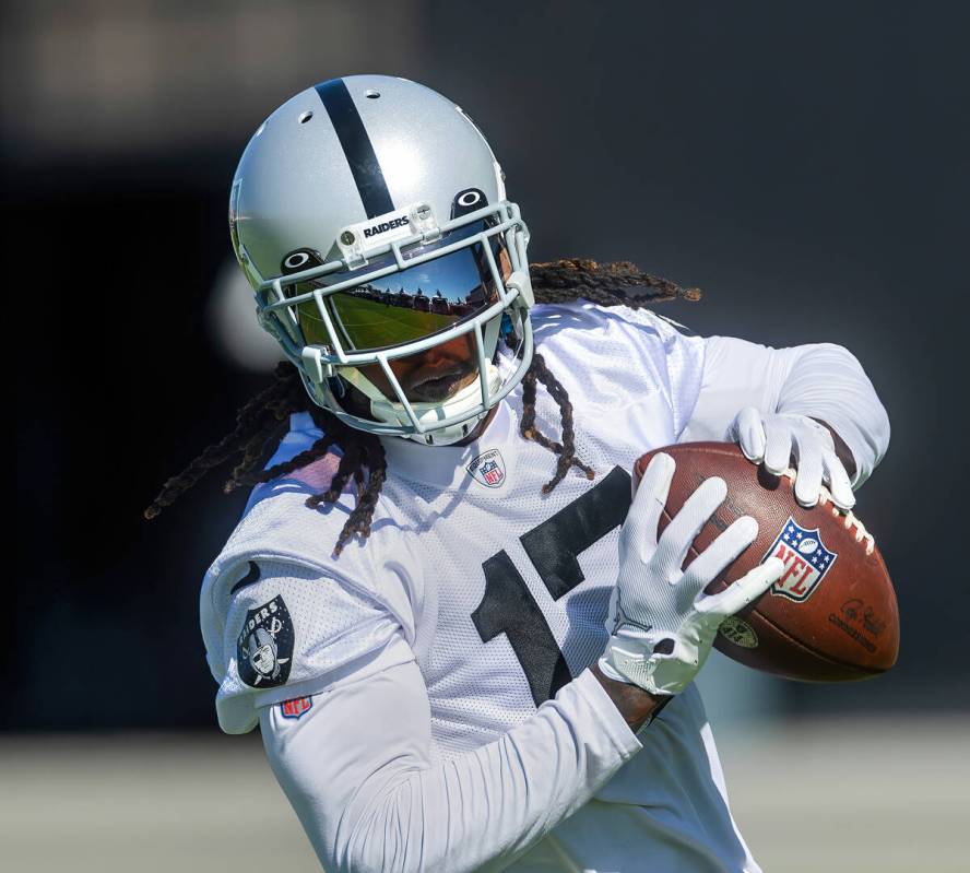 Wide receiver Davante Adams (17) catches a pass during the Raiders first practice at training c ...