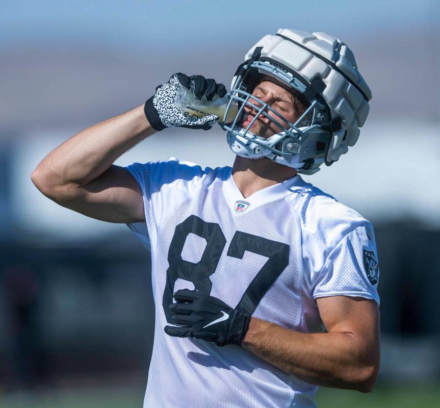 Tight end Foster Moreau (87) hydrates during the Raiders first practice at training camp in the ...