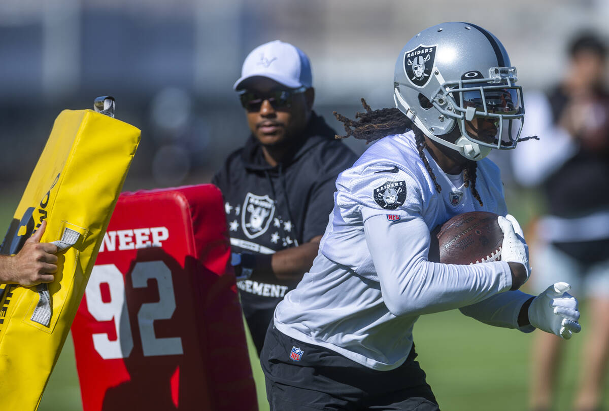 Wide receiver Davante Adams (17) runs through blocking pads during the Raiders first practice a ...