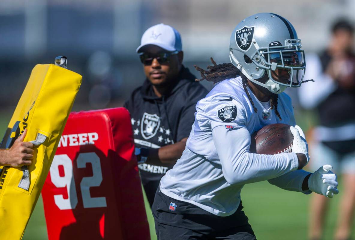 Wide receiver Davante Adams (17) runs through blocking pads during the Raiders first practice a ...