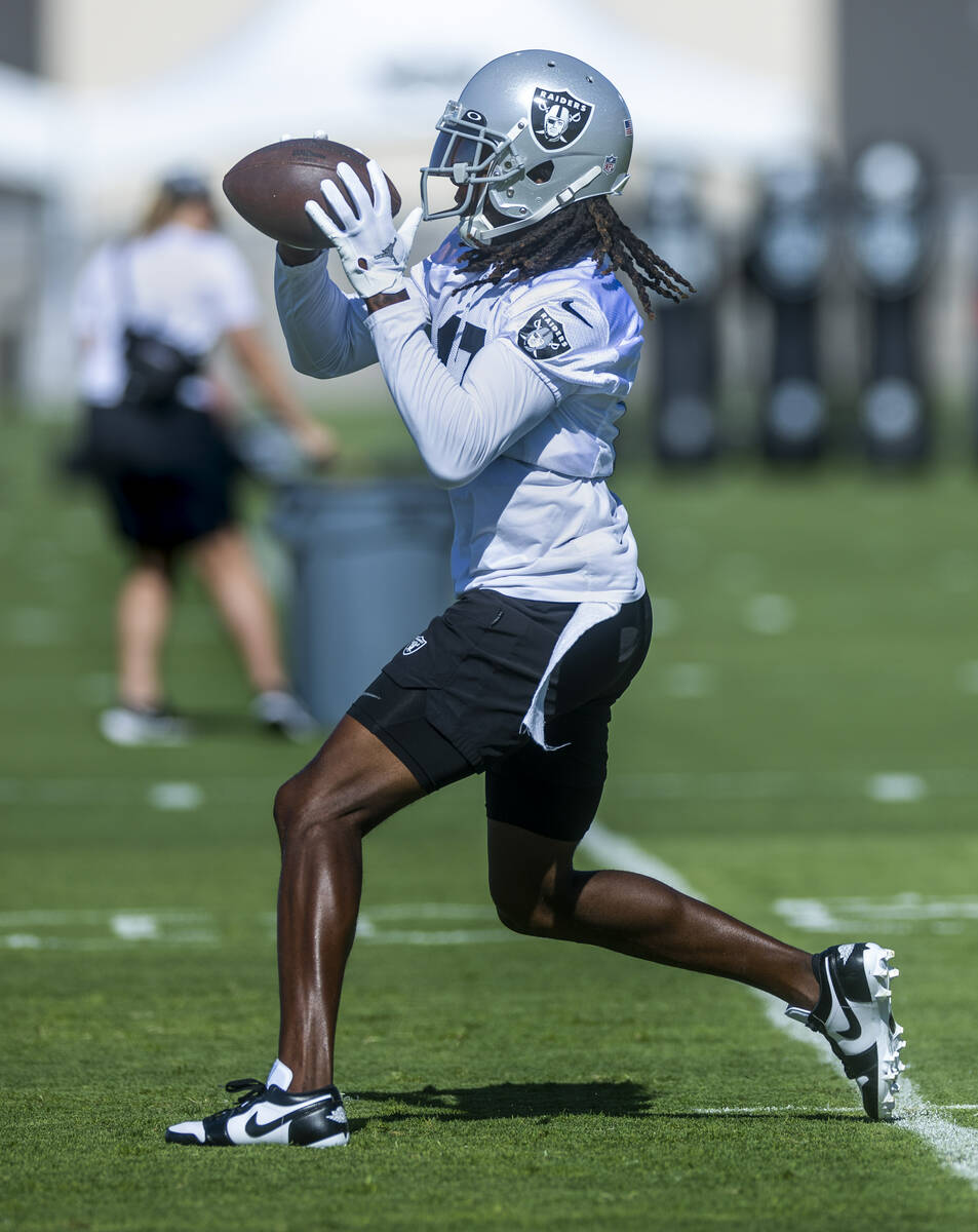 Wide receiver Davante Adams (17) catches a pass during the Raiders first practice at training c ...