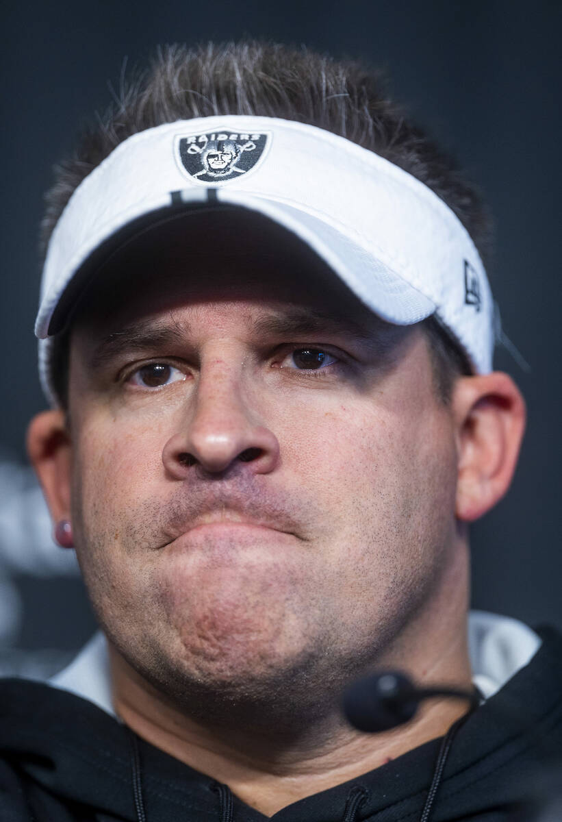 Raiders head coach Josh McDaniels considers a response during their first practice at training ...