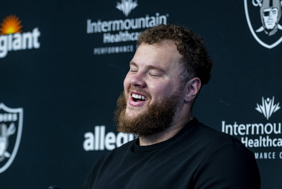 Center Andre James laughs in a press conference during the Raiders first practice at training c ...