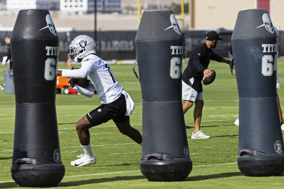 Raiders wide receiver Davante Adams (17) runs the drill during team's practice at training camp ...