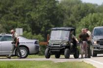 Emergency personnel block an entrance to the Maquoketa Caves State Park as police investigate a ...