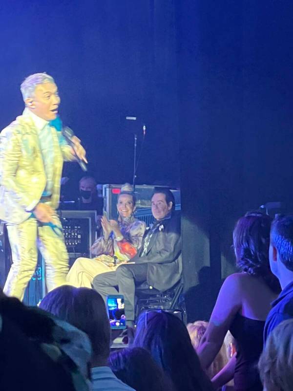 Arnel Pineda performs as Wayne and Kathleen look on during Journey's performance at Resorts Wor ...