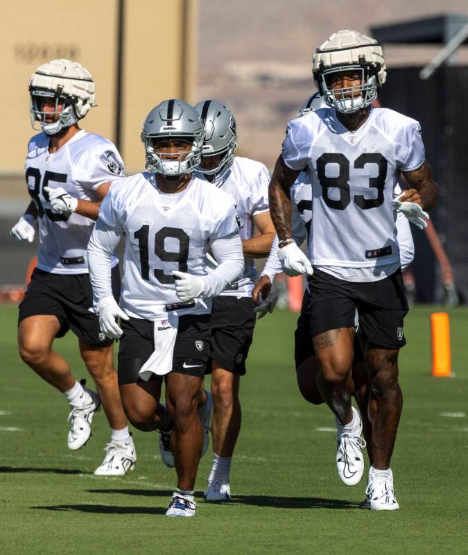 Raiders tight end Cole Fotheringham (85), wide receiver DJ Turner (19) and tight end Darren Wal ...