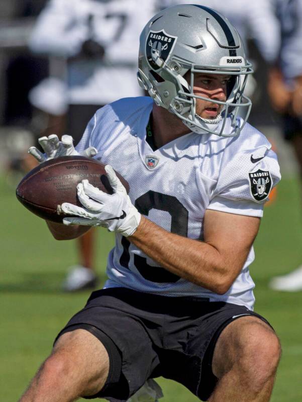 Raiders wide receiver Hunter Renfrow (13) looks to run after making a catch during the team&#x2 ...