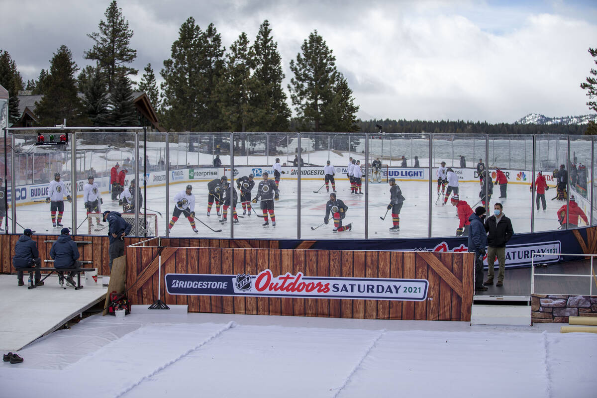 Vegas Golden Knights practice on an outdoor rink built over the 18th fairway of a golf course i ...