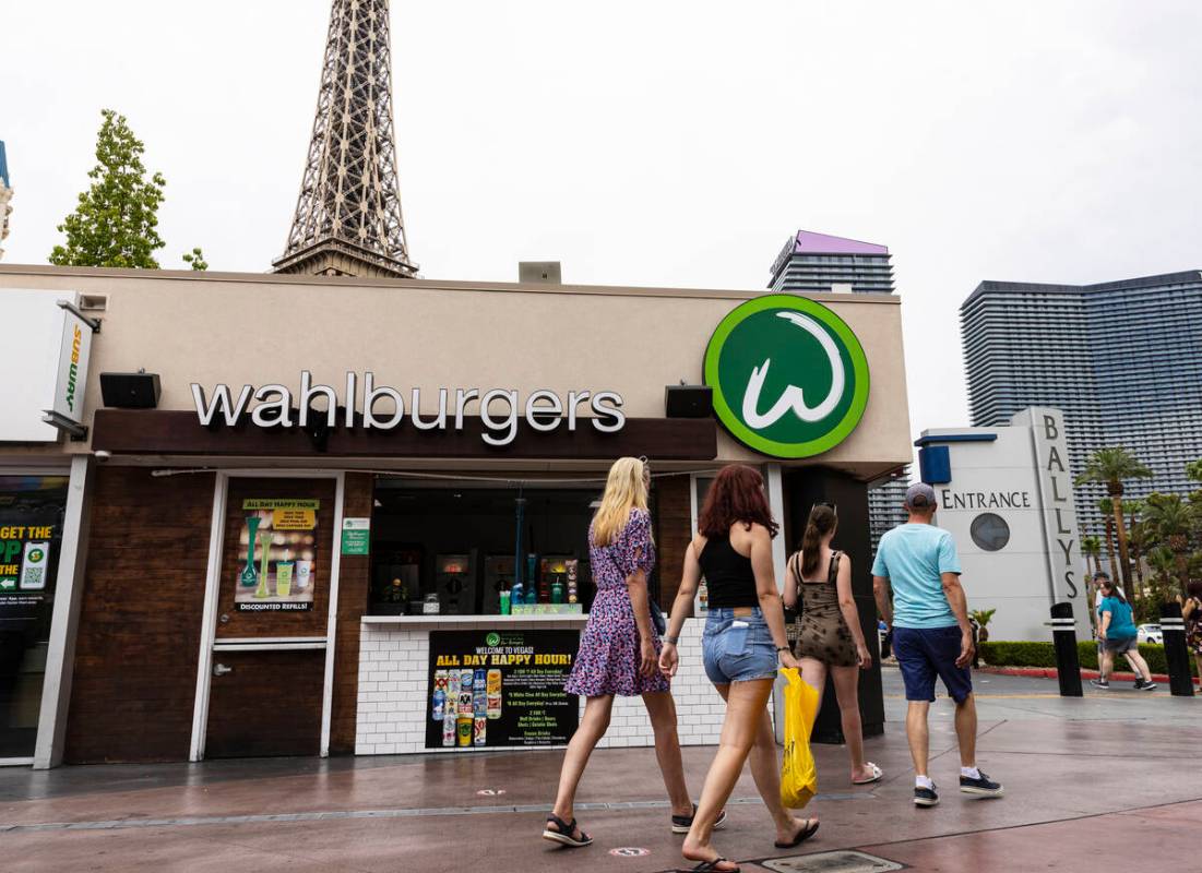 Pedestrians walk past Wahlburgers restaurant on Tuesday, July 26, 2022, on the Las Vegas.strip. ...