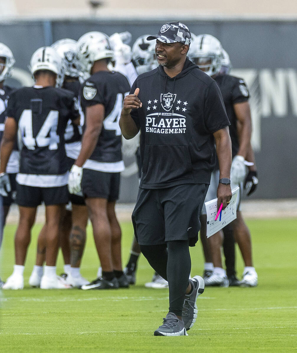 Raiders defensive coordinator Patrick Graham talks to players during training camp in the Inter ...