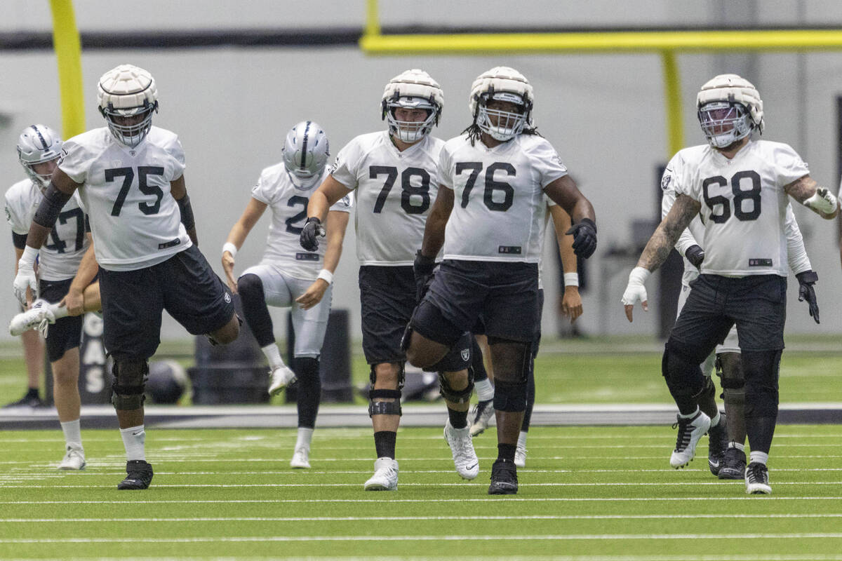 Offensive lineman, from left, Brandon Parker (75), Jackson Barton (78), John Simpson (76) and A ...