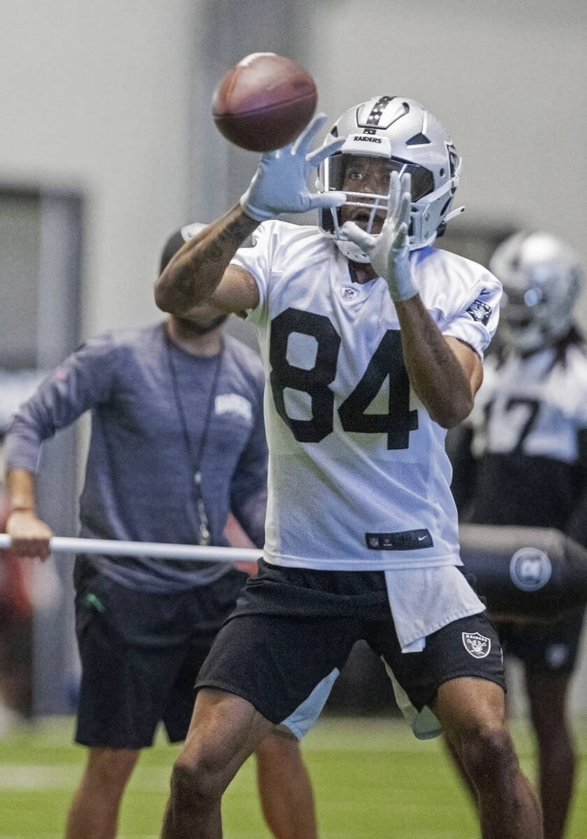 Raiders wide receiver Keelan Cole (84) makes a catch during the team’s training camp pra ...