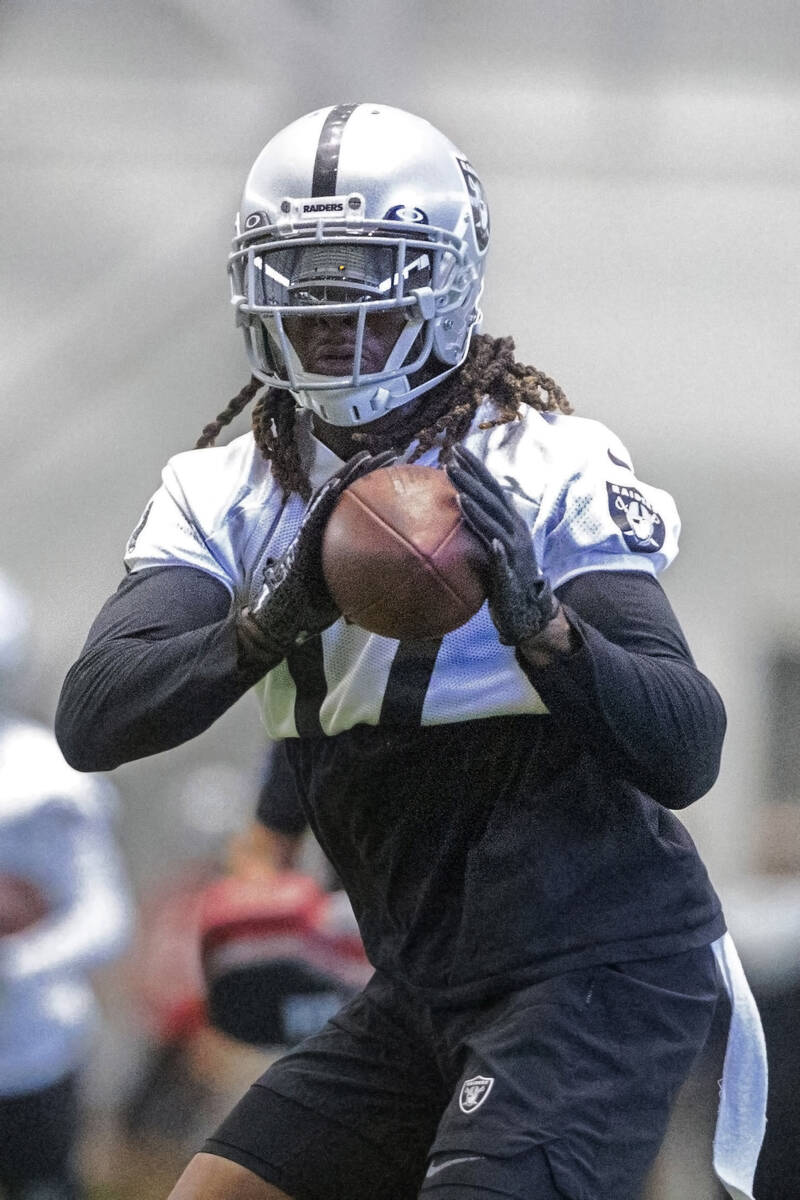 Raiders wide receiver Davante Adams (17) makes a catch during the team’s training camp p ...