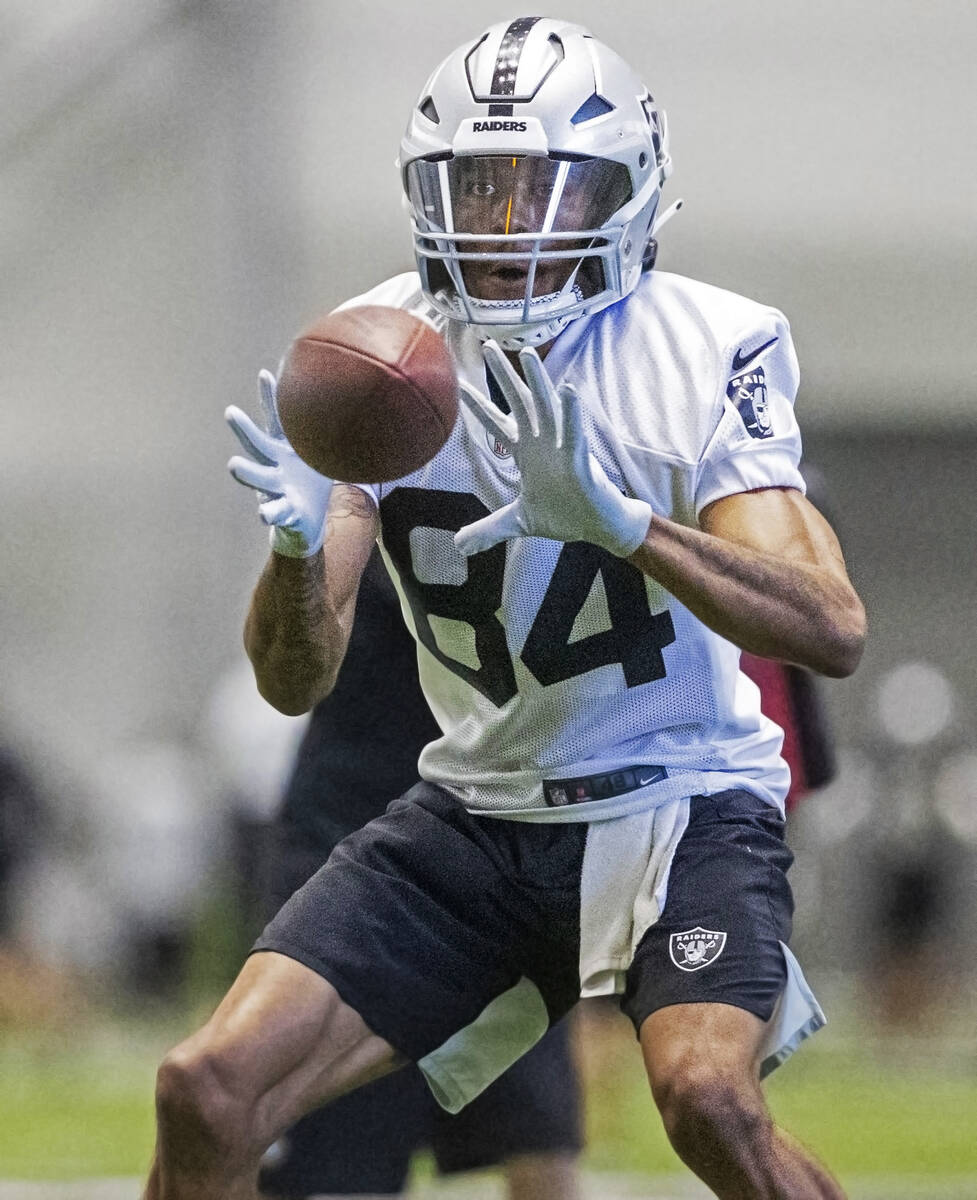 Raiders wide receiver Keelan Cole (84) makes a catch during the team’s training camp pra ...