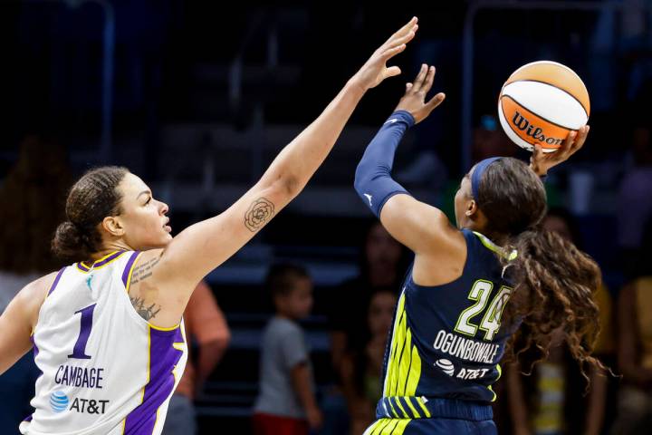 Los Angeles Sparks center Liz Cambage (1) defends against Dallas Wings guard Arike Ogunbowale d ...