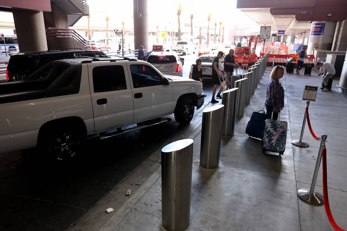 Newly installed traffic safety bollards along the check-in curb at Terminal 1 at Harry Reid Int ...