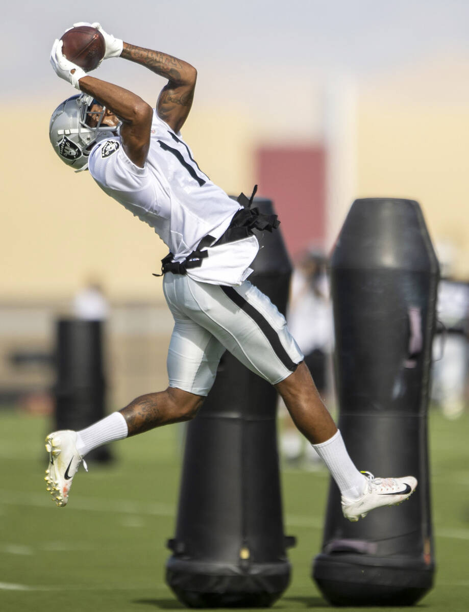 Raiders wide receiver Demarcus Robinson (11) makes a catch during the team’s training ca ...