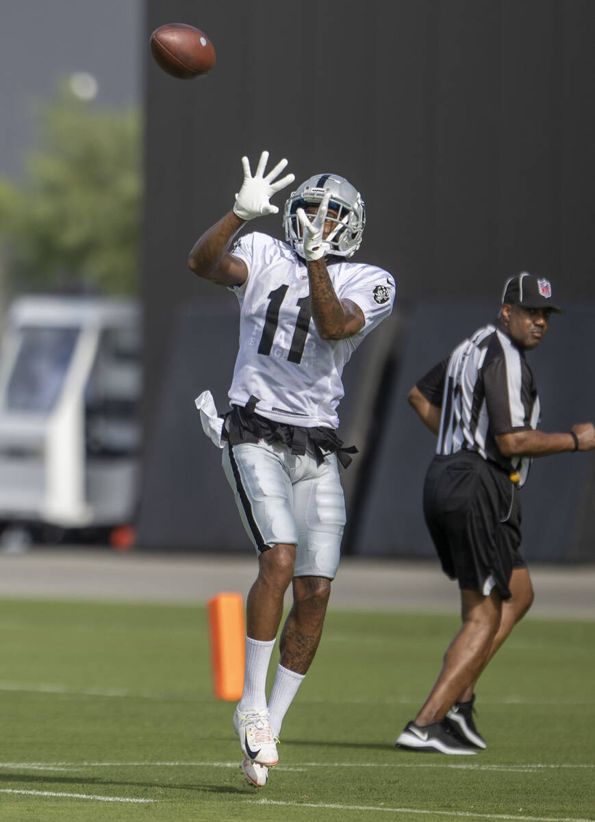 Raiders wide receiver Demarcus Robinson (11) leaps for a catch during the team’s trainin ...