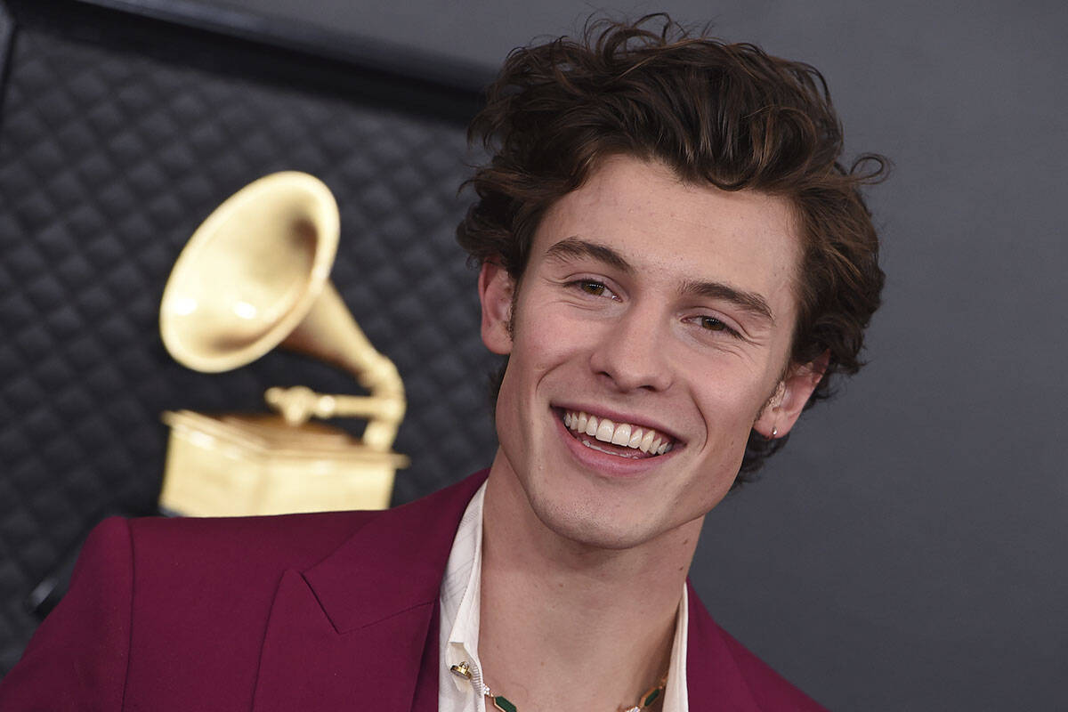 FILE - Shawn Mendes arrives at the 62nd annual Grammy Awards in Los Angeles, Jan. 26, 2020. Men ...
