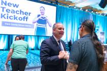 Superintendent Jesus Jara, left, speaks to Yosvani Gomez, culinary teacher at Rancho High Schoo ...