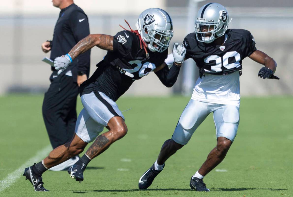 Raiders cornerback Anthony Averett (29) works against cornerback Nate Hobbs (39) during the tea ...