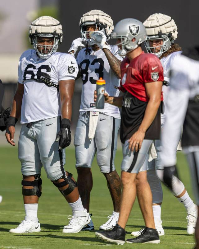 Raiders offensive guard Dylan Parham (66), tight end Darren Waller (83), quarterback Derek Carr ...