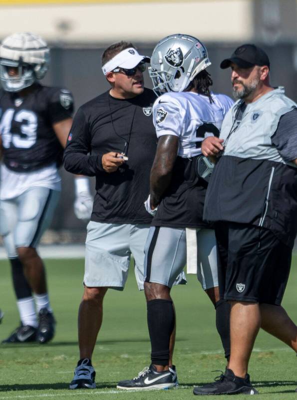 Raiders head coach Josh McDaniels instructs running back Ameer Abdullah (22) during the team&#x ...