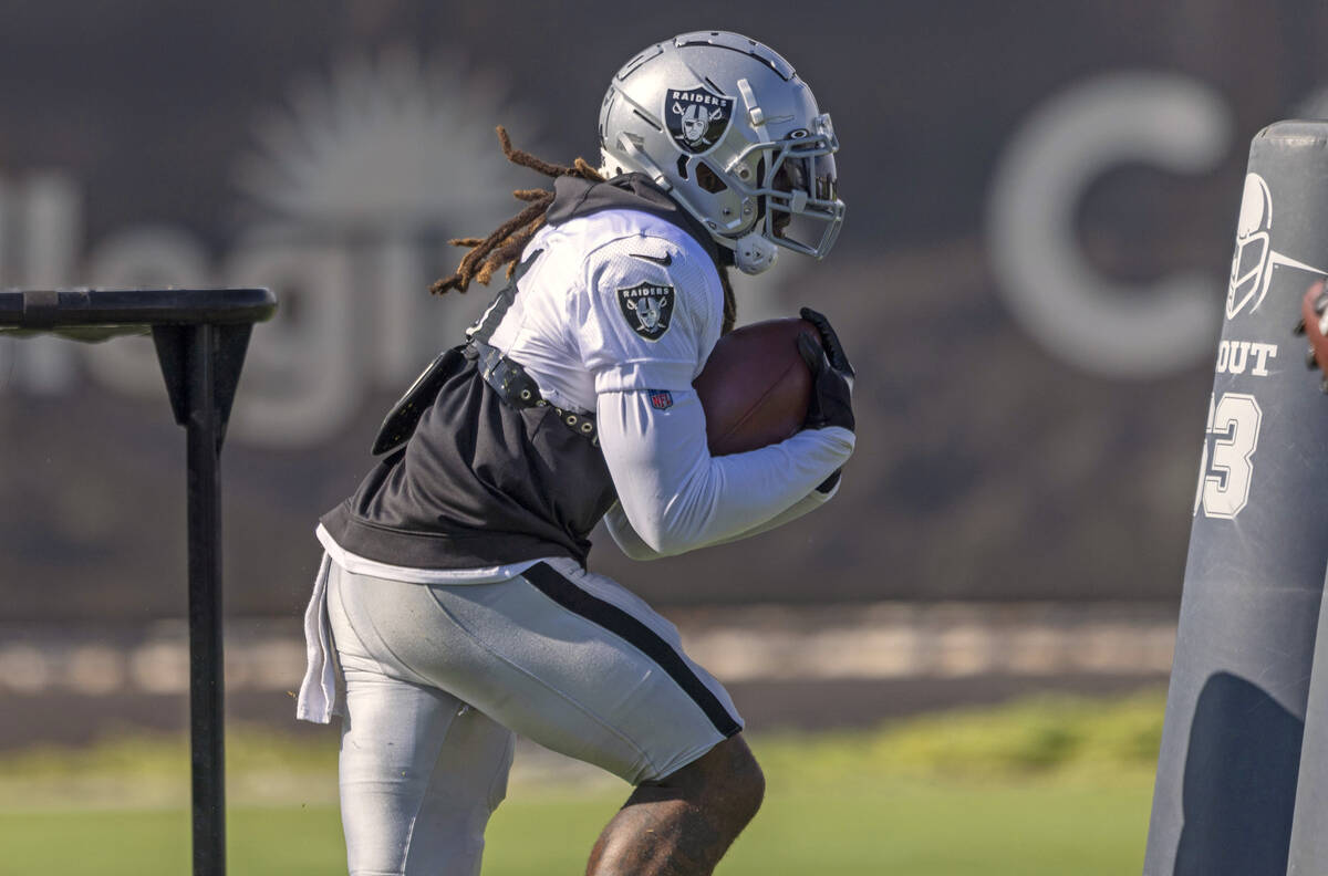 Raiders running back Brandon Bolden (34) runs through a drill during the team’s training ...