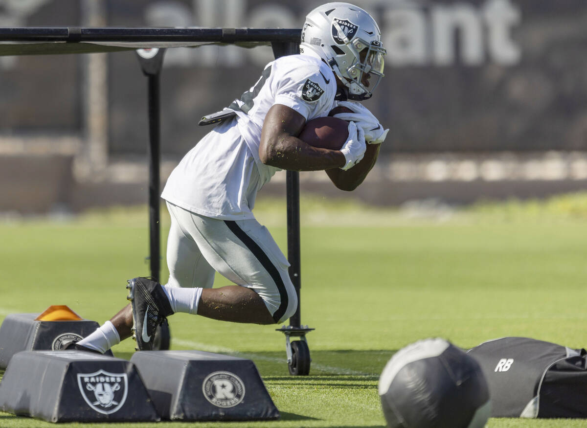 Raiders running back Brittain Brown (38) runs with the football during the team’s traini ...