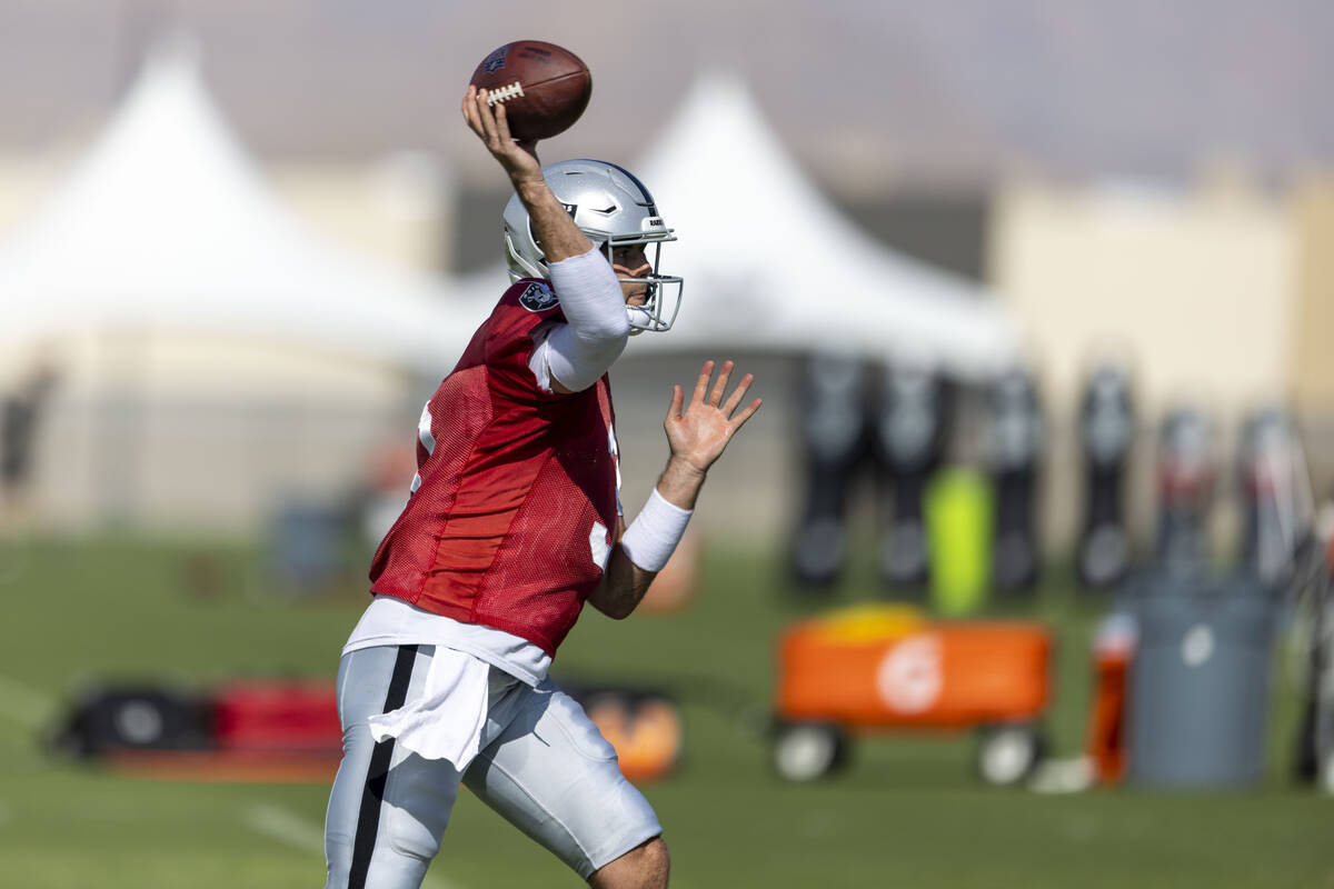 Raiders quarterback Jarrett Stidham (3) throws during the team’s training camp practice ...