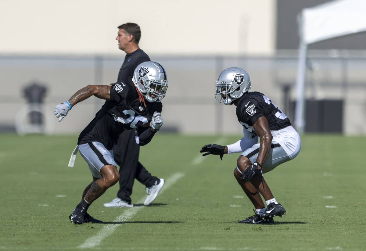 Raiders cornerback Anthony Averett (29) works against cornerback Nate Hobbs (39) during the tea ...