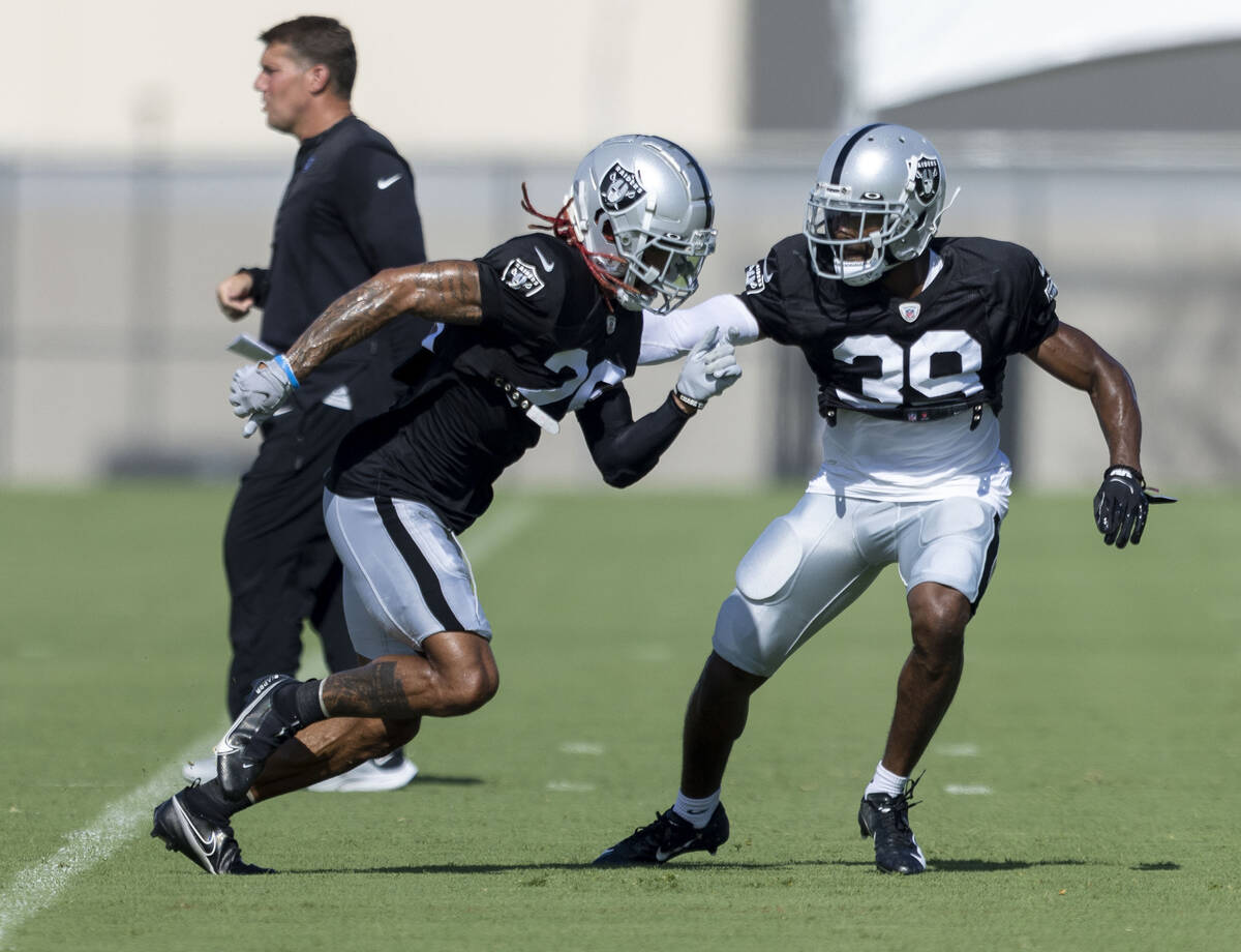 Raiders cornerback Anthony Averett (29) works against cornerback Nate Hobbs (39) during the tea ...