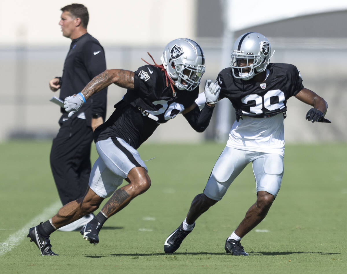 Raiders cornerback Anthony Averett (29) works against cornerback Nate Hobbs (39) during the tea ...