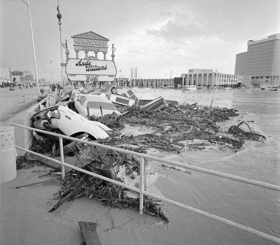 Floodwaters sink cars and fill the Caesars Palace parking lot during a flash flood July 3, 1975 ...