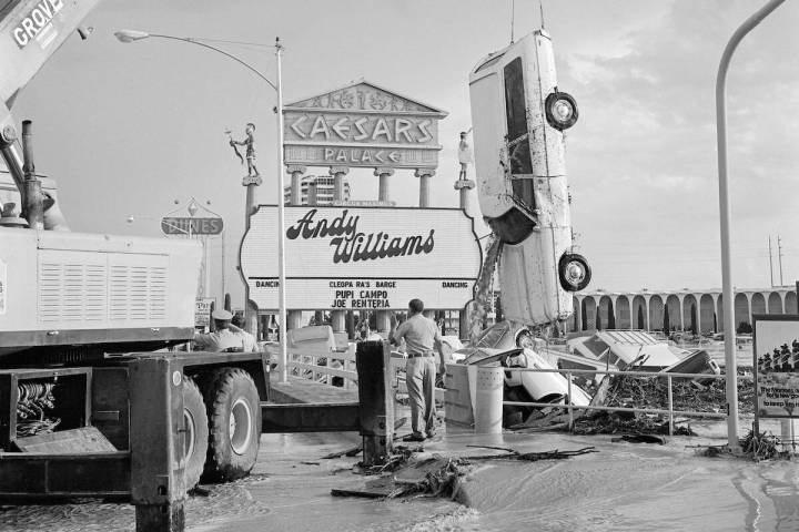 Floodwaters sink cars and fill the Caesars Palace parking lot during a flash flood July 3, 1975 ...