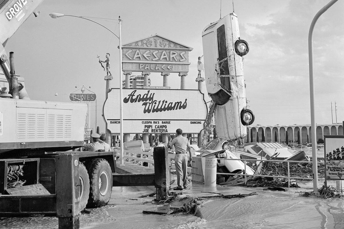 Floodwaters sink cars and fill the Caesars Palace parking lot during a flash flood July 3, 1975 ...