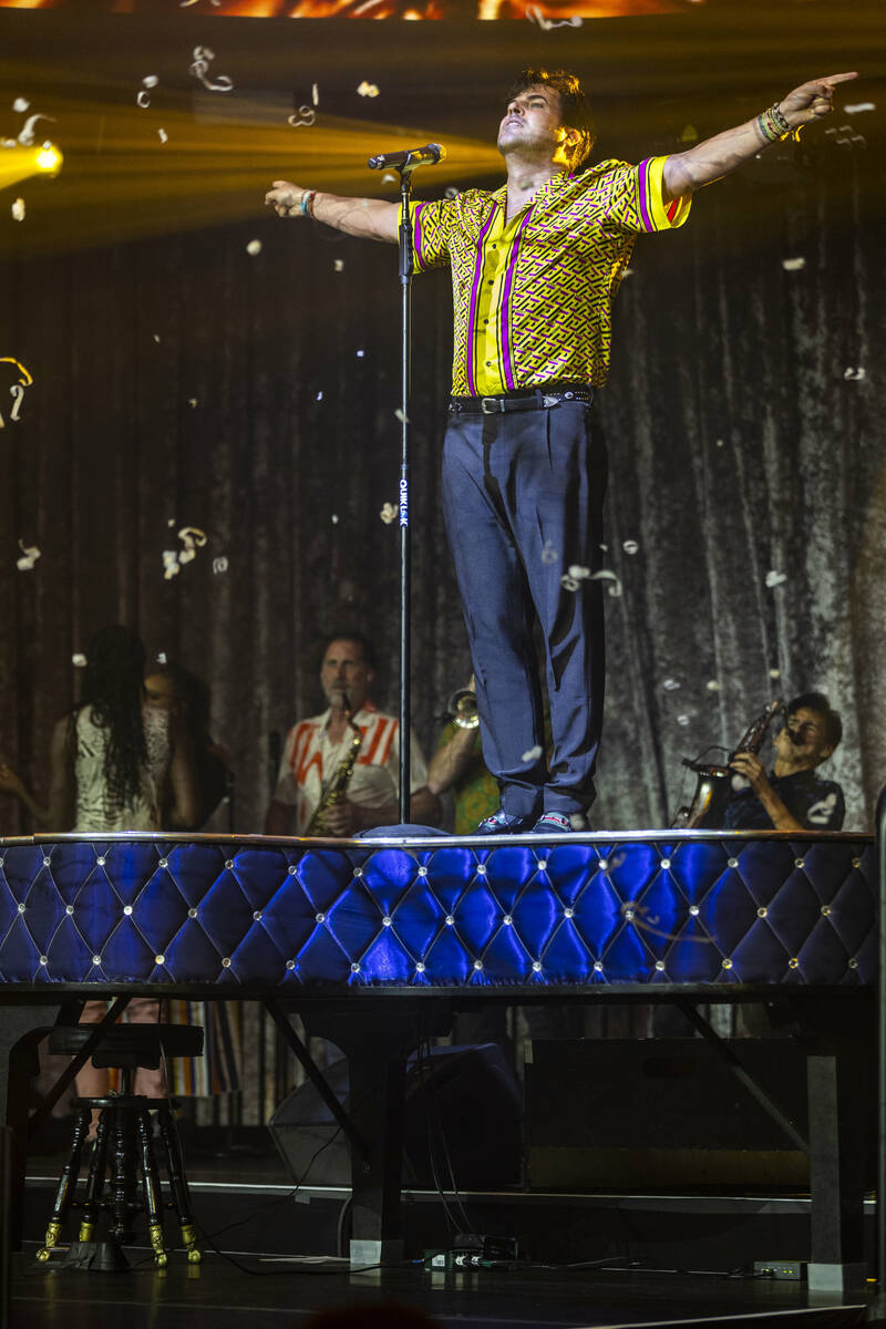 Frankie Moreno sings atop the piano during the opening night performance of his the first resid ...