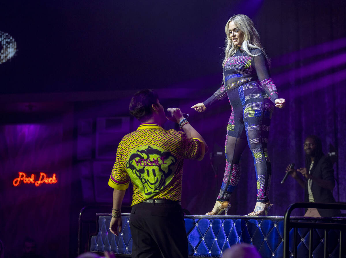 Lacey Schwimmer dances atop the piano as Frankie Moreno sings during the opening night performa ...
