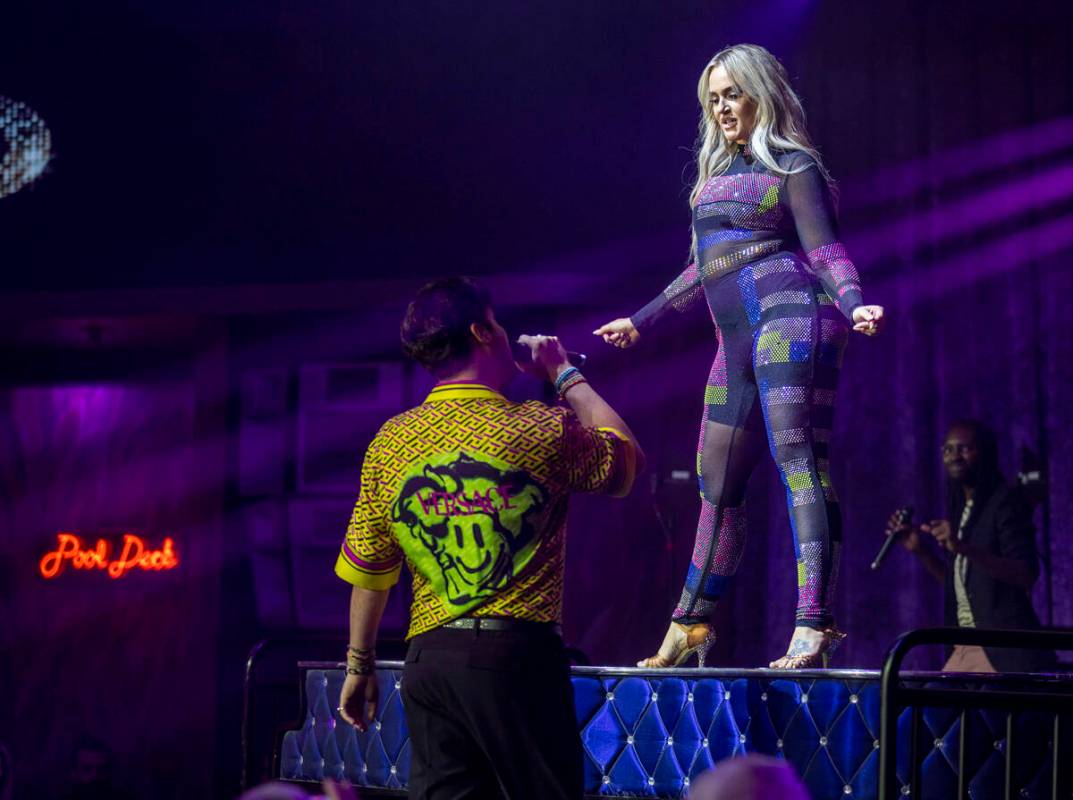 Lacey Schwimmer dances atop the piano as Frankie Moreno sings during the opening night performa ...