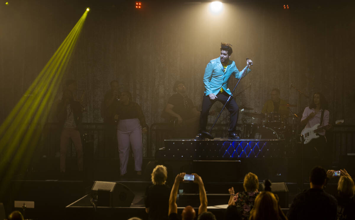 Frankie Moreno sings and dances atop his piano during the opening night performance of his the ...