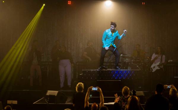 Frankie Moreno sings and dances atop his piano during the opening night performance of his the ...